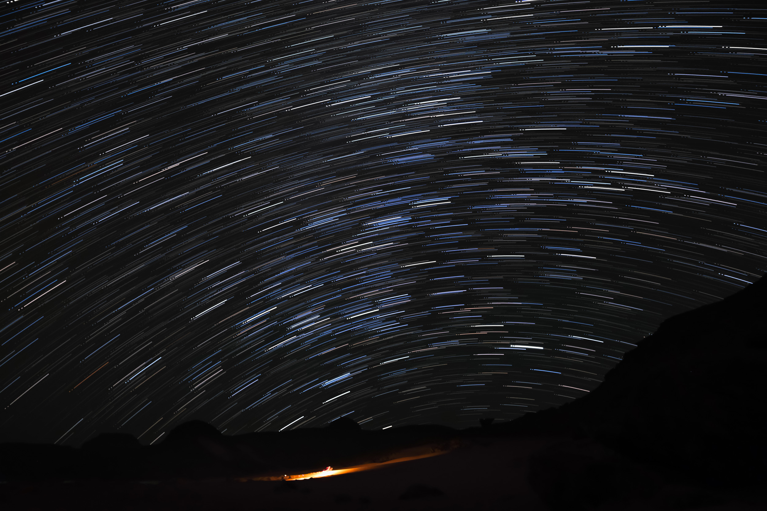 Starry night over Tadrart desert in Algeria with dunes