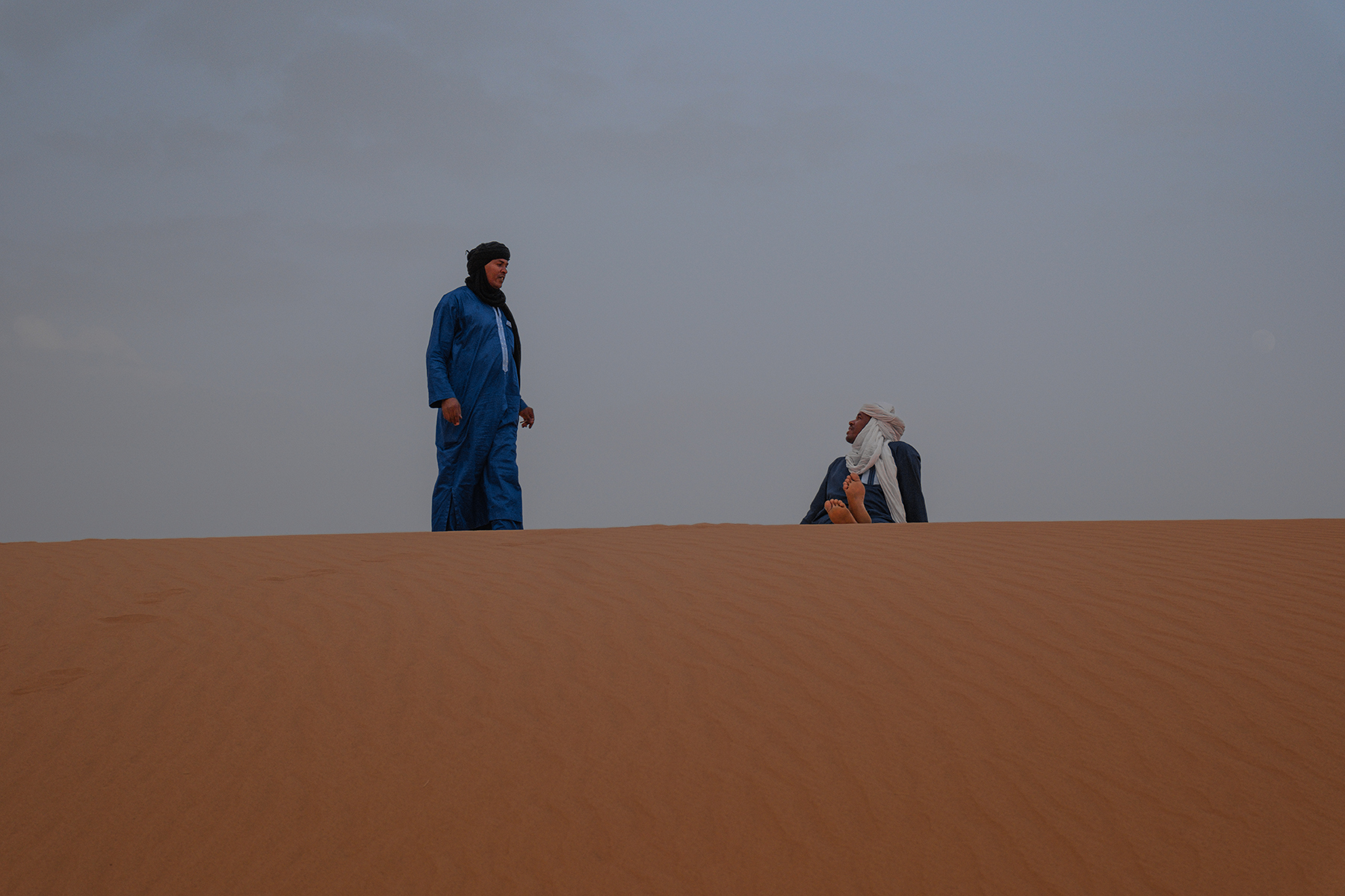 Tuareg guide walking in Sahara desert in Algeria
